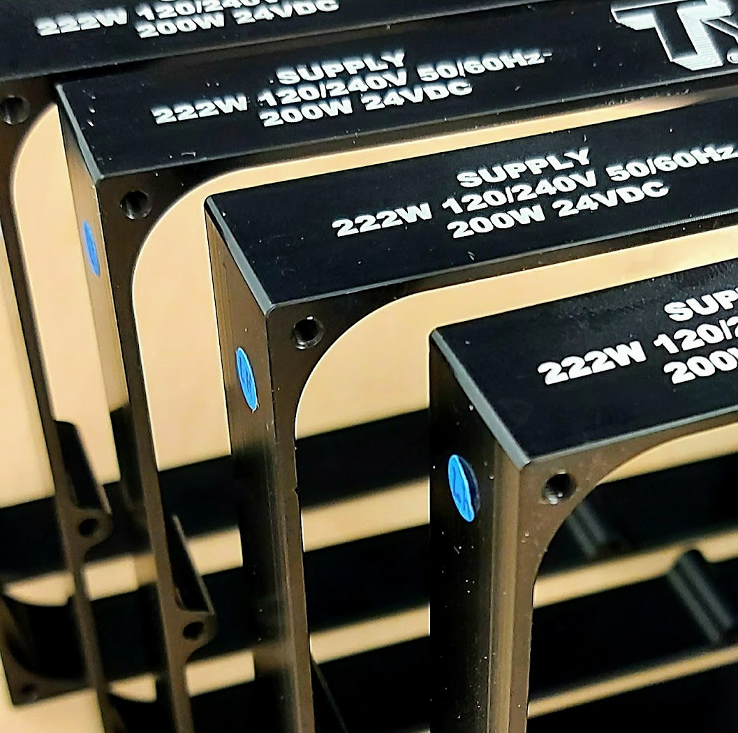 Black and gold industrial tags from Aran Awards in Hamilton