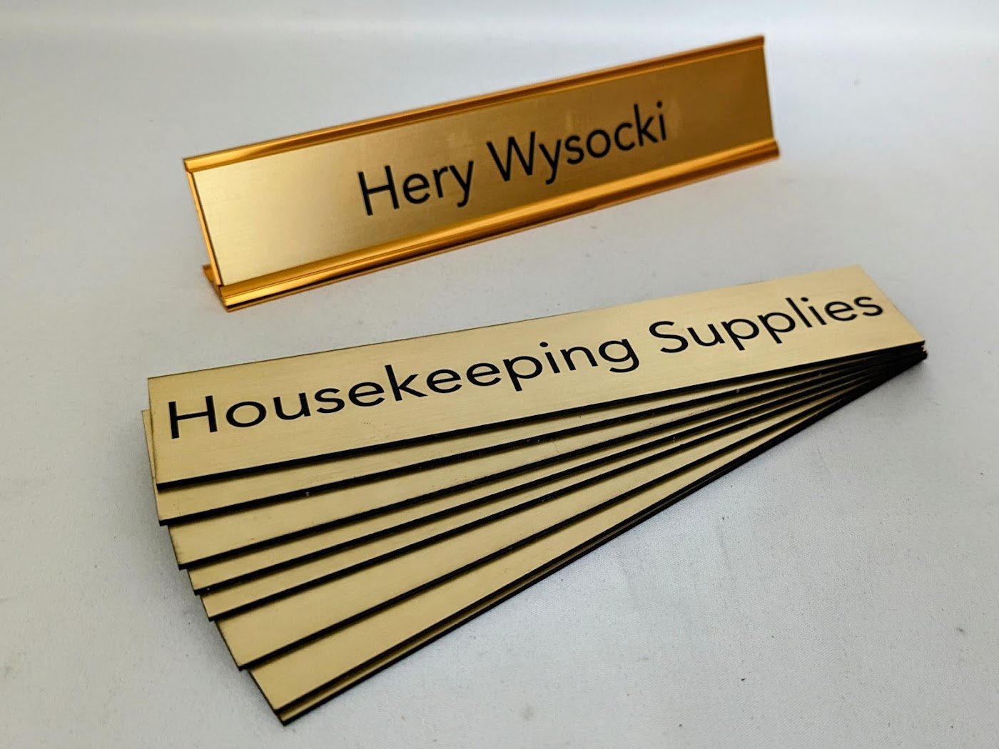 Desk wedge nameplates with high contrast engraved lettering from Aran Awards in Hamilton