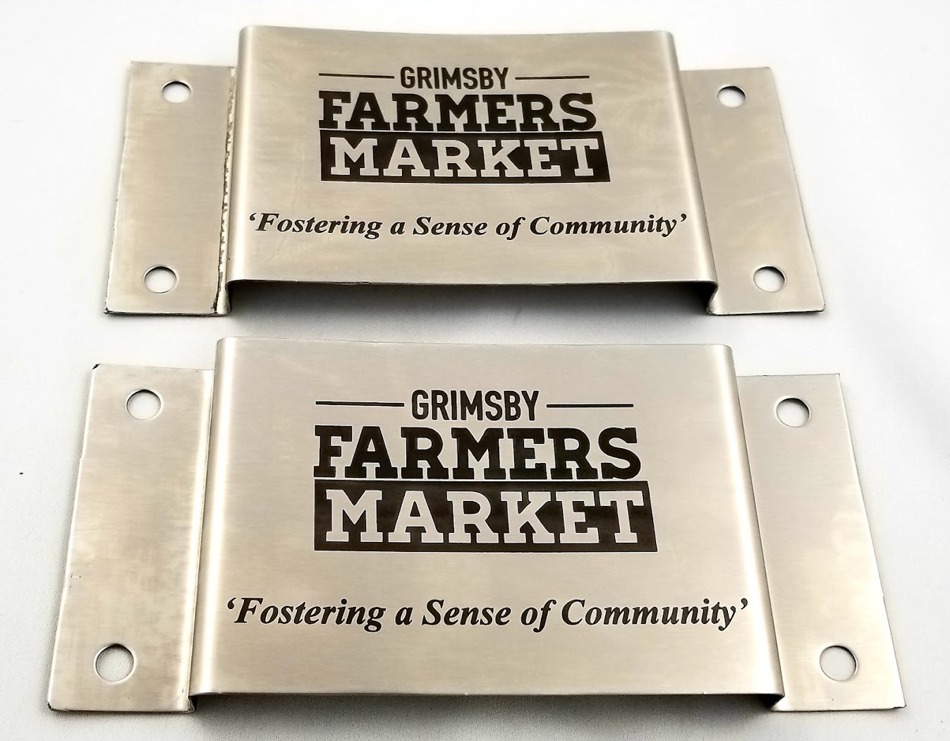 Engraved metal tags from Aran Awards in Hamilton