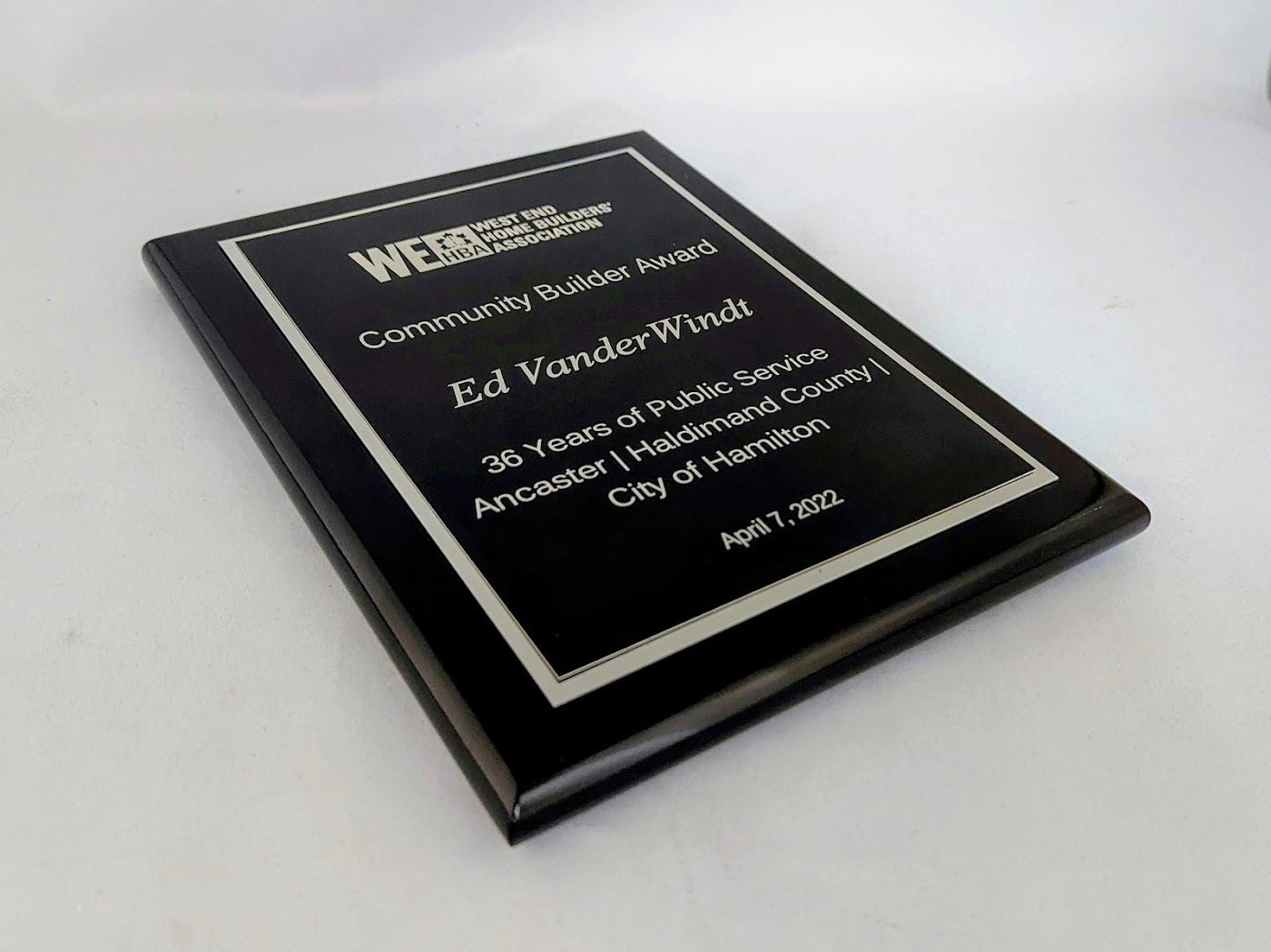 Award plaque with readable title name and supporting inscription hierarchy