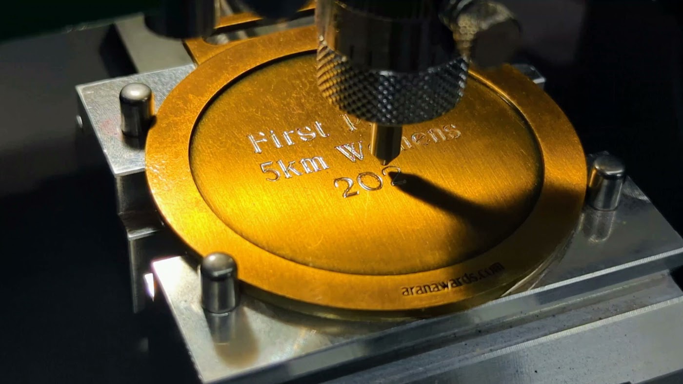 Engraving machine close-up at Aran Awards in Hamilton