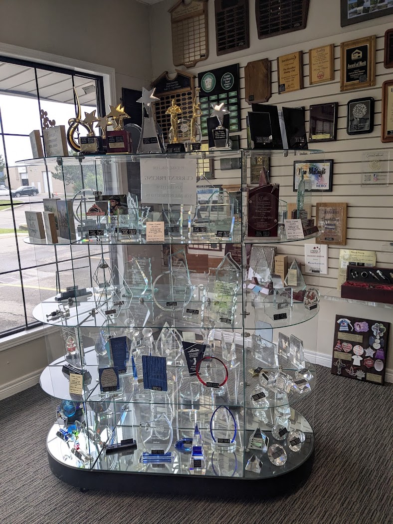 Aran Awards Showroom Awards Display Case | Hamilton Showroom display case with trophies, plaques, and awards