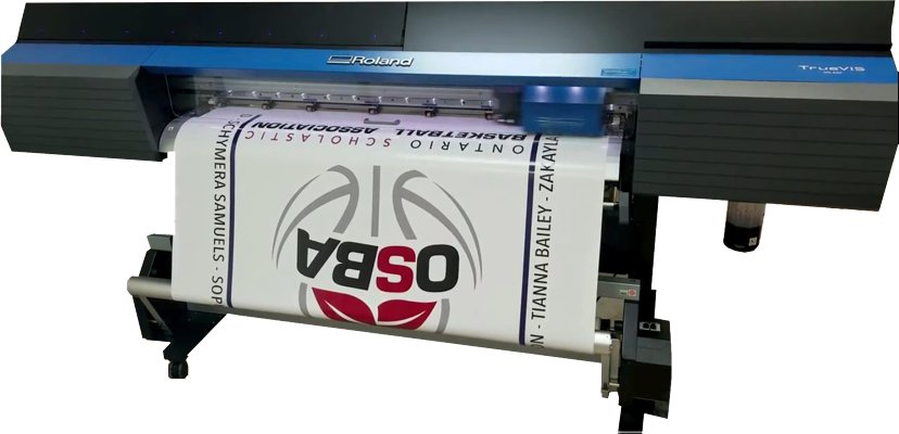 The Roland VersaCAMM VG-540 wide-format printer producing a vibrant, full-colour banner.