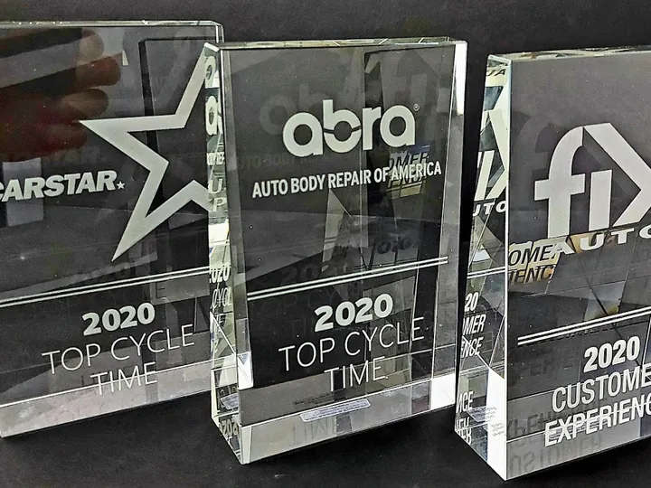 Clear acrylic awards prepared by Aran Awards